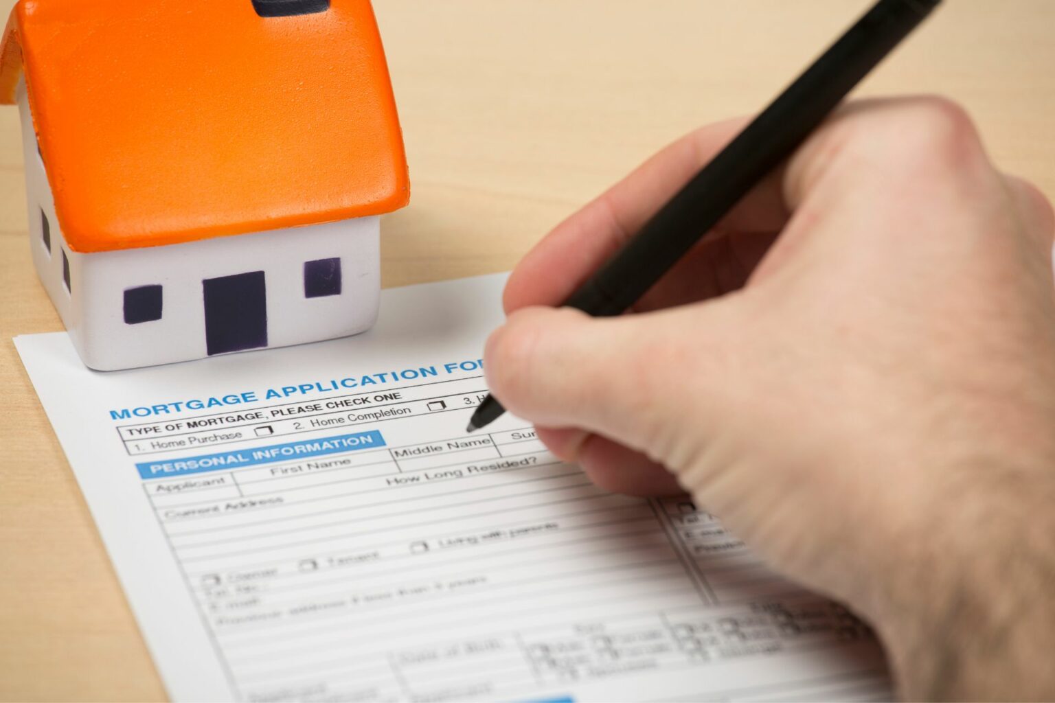 a person completing a mortgage application