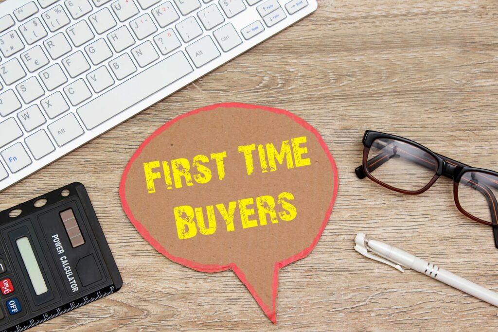 calculator, keyboard pen and glass - with a speech bubble "first time buyers"