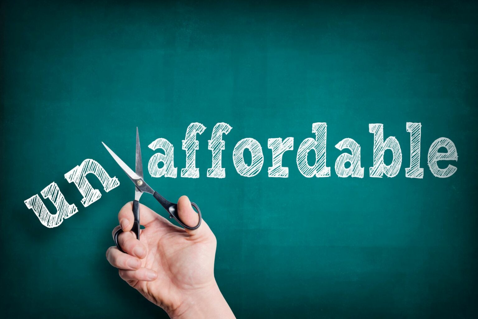 the word unaffordable with a pair of scissors cutting off the U N